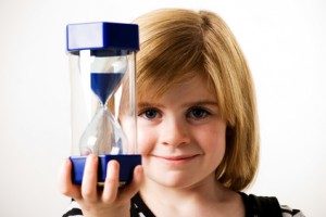 girl holding hourglass